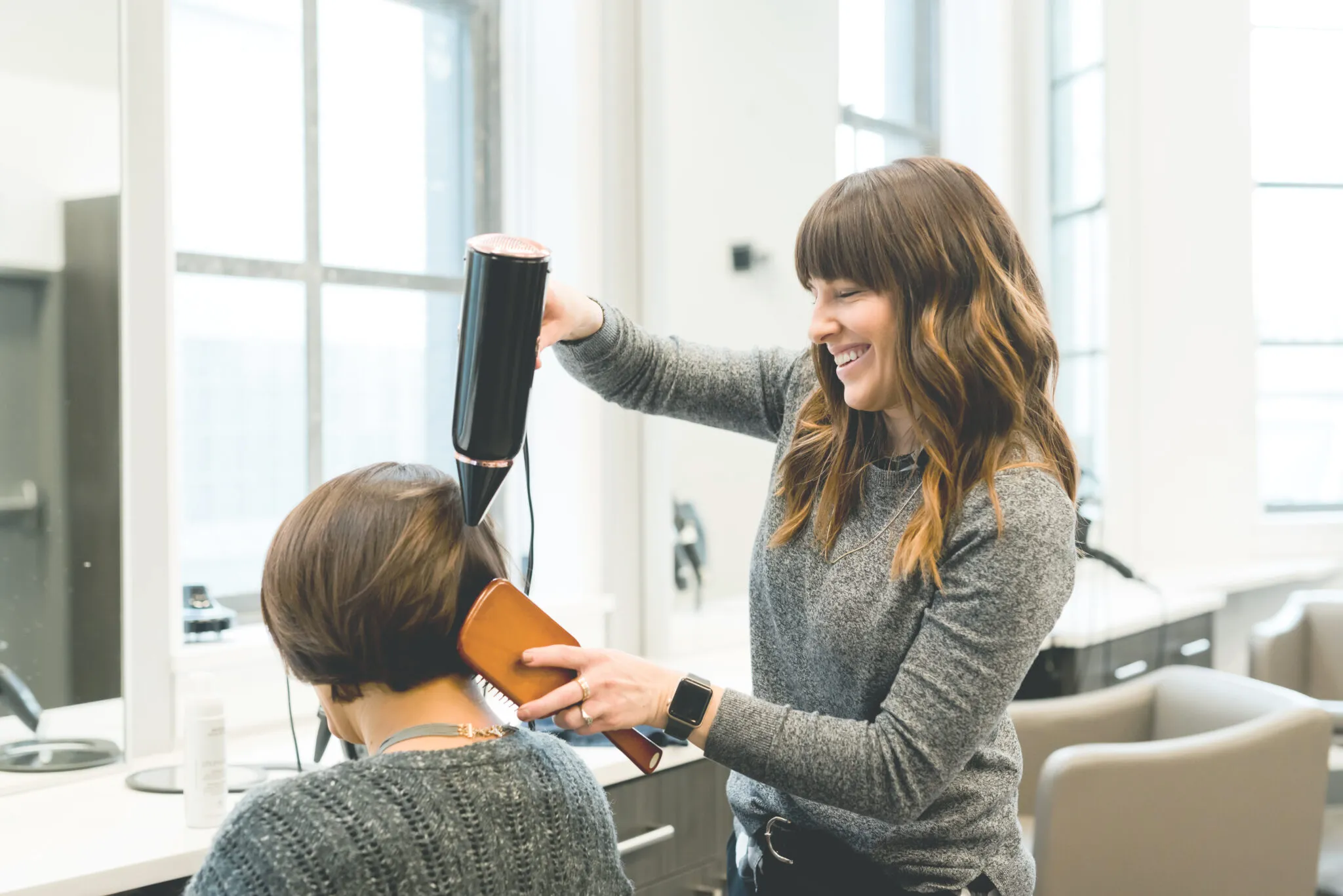 Hair stylist shaping a client's hair