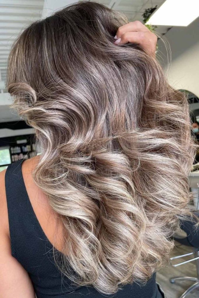 Voluminous polished blowout hairstyle